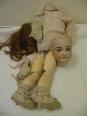 Appraisal: A Kestner bisque head girl doll fully restored with blue