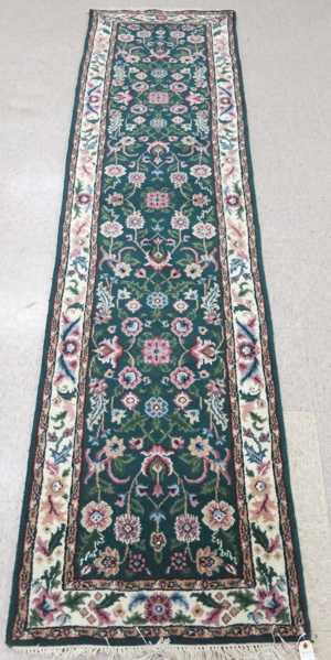 Appraisal: HAND KNOTTED ORIENTAL RUNNER Indo-Persian floral design on green ground