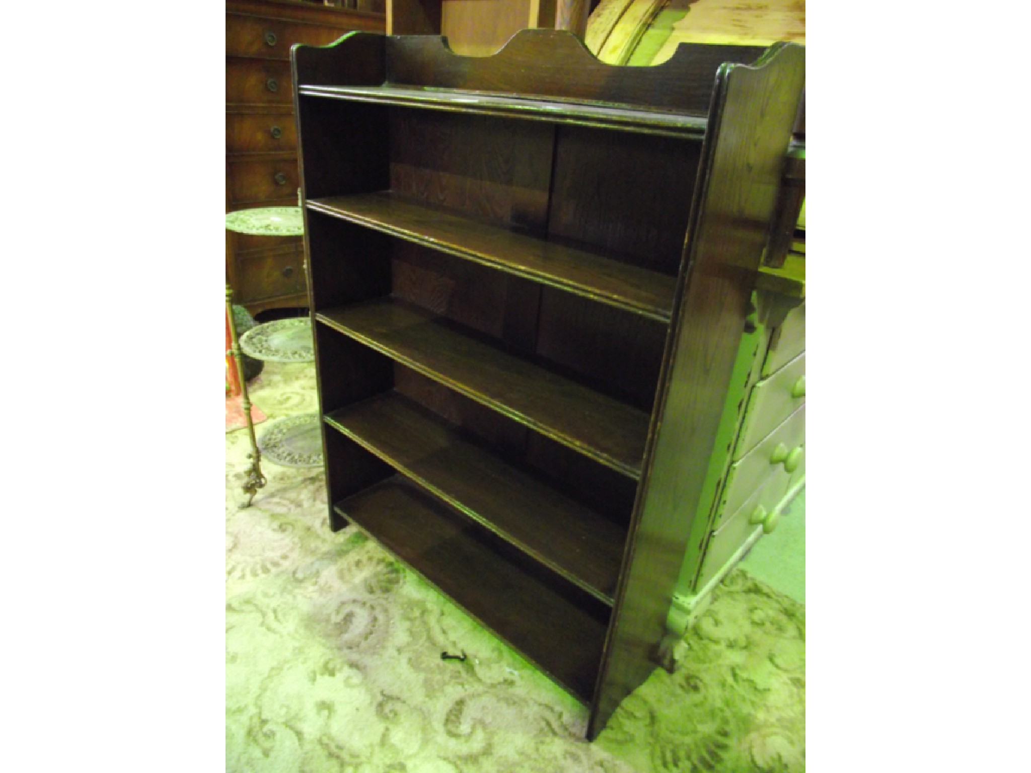 Appraisal: An oak bookcase fitted with four shelves a Victorian stripped