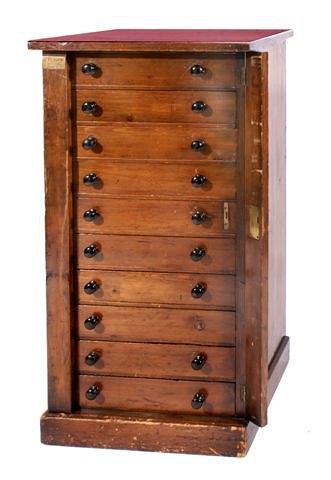 Appraisal: A Victorian stained pine Wellington or collector's chest of ten