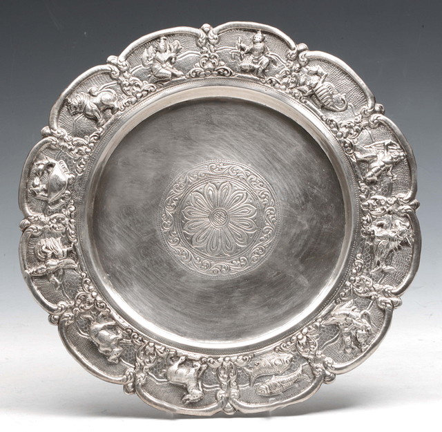 Appraisal: A BURMESE SILVER PLATE the embossed border showing signs of