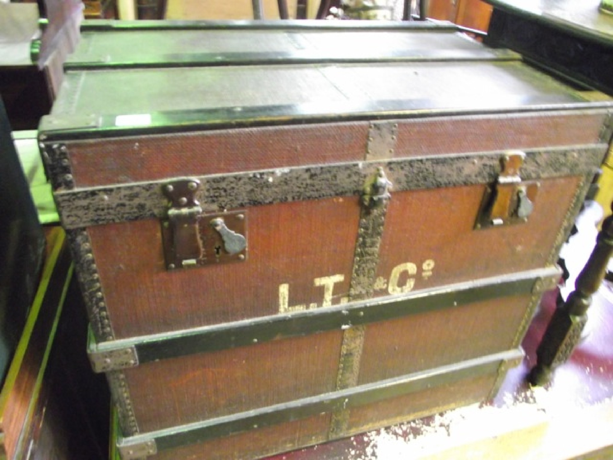 Appraisal: A vintage fibre and wooden lathe bound travelling trunk with