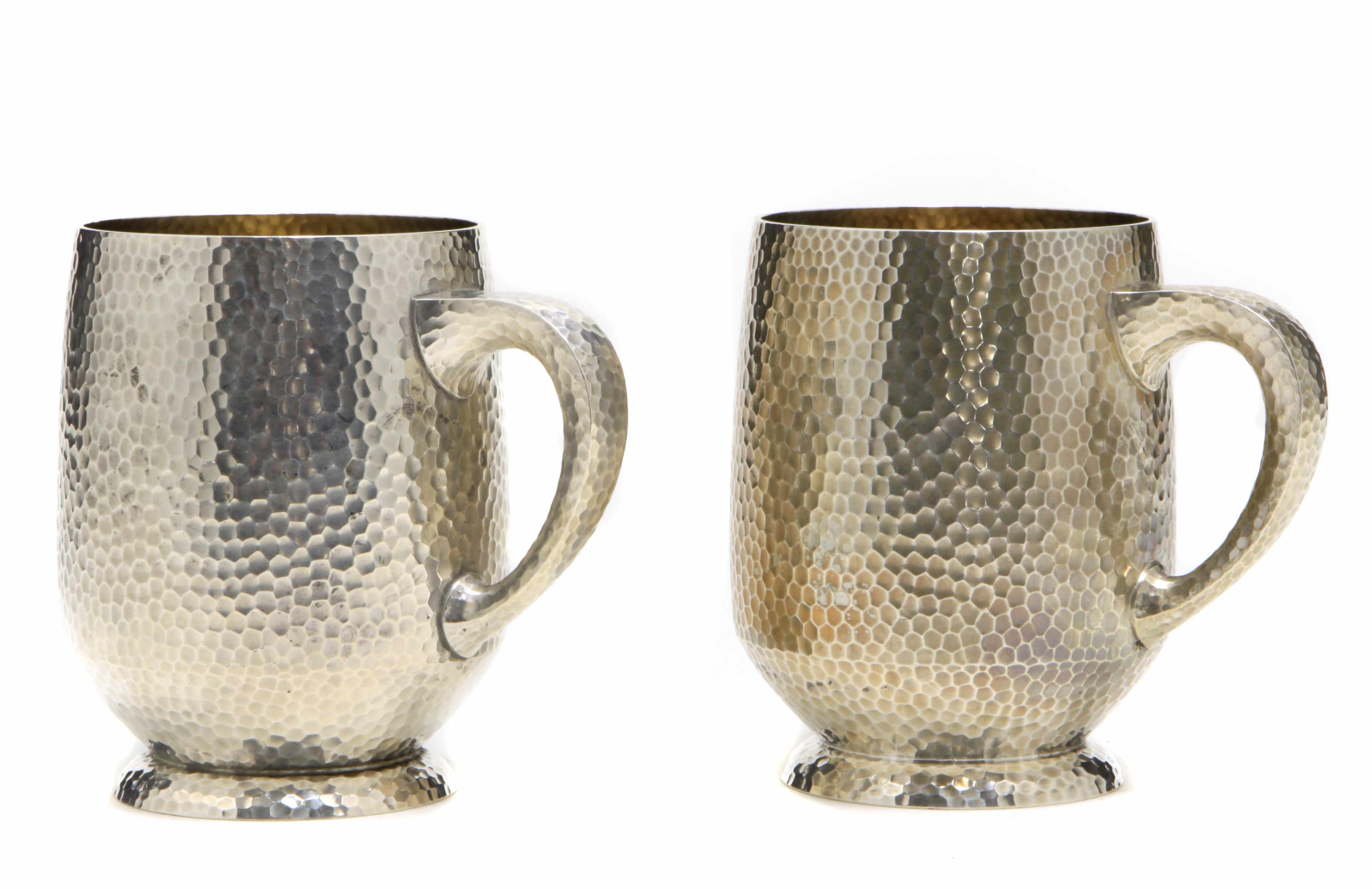 Appraisal: A pair of German hammered standard silver Jugendstil mugs M