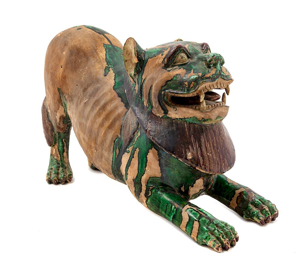 Appraisal: A Chinese Green and Straw Glazed Pottery Figure of a