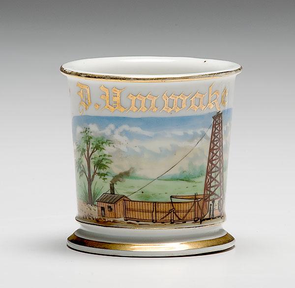 Appraisal: OCCUPATIONAL SHAVING MUG OF OIL DERRICK porcelain with polychrome painted