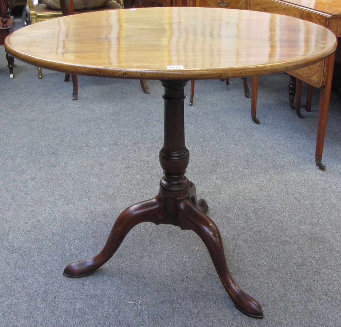 Appraisal: A George III mahogany occasional table the oval snap top