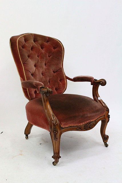 Appraisal: A VICTORIAN PINK DRAYLON UPHOLSTERED AND BUTTON BACKED OPEN ARMCHAIR