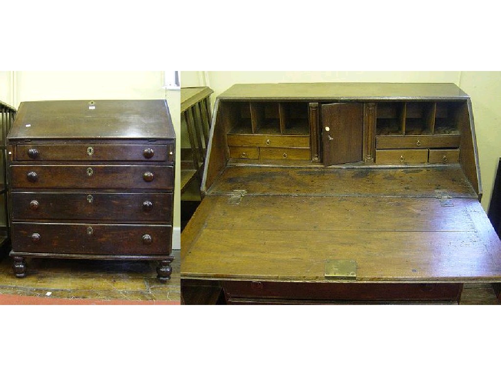 Appraisal: A Georgian oak bureau the fall flap enclosing an interior