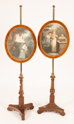 Appraisal: A pair of George IV rosewood and mahogany pole screens