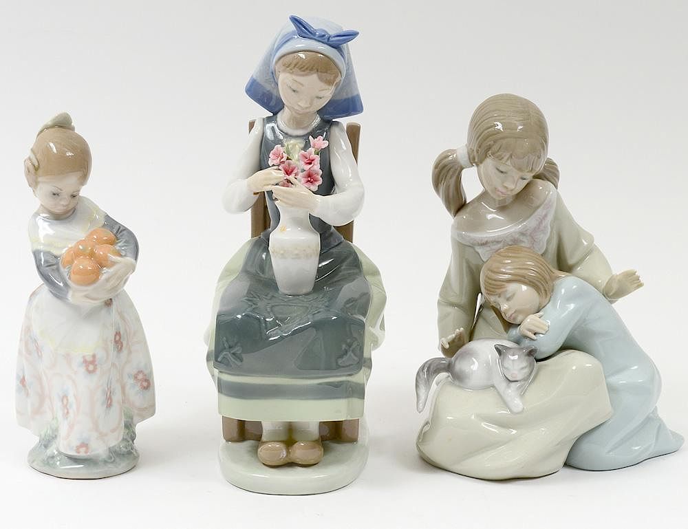 Appraisal: THREE LLADRO PORCELAIN FIGURES Spanish Comprising girl with fruit height