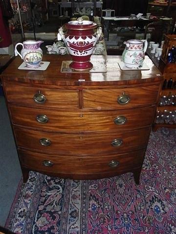 Appraisal: A TH CENTURY MAHOGANY BOW FRONT CHEST of two short