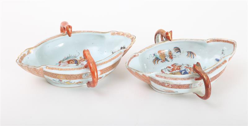 Appraisal: TWO SIMILAR CHINESE EXPORT FAMILLE VERTE ARMORIAL PORCELAIN SAUCE BOATS