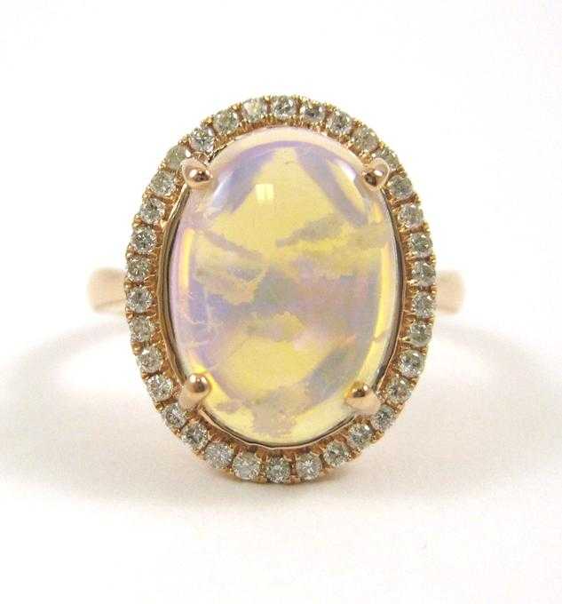 Appraisal: JELLY OPAL AND FOURTEEN KARAT ROSE GOLD RING with round-cut