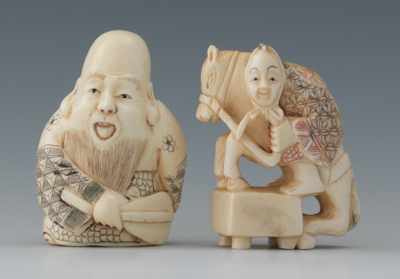 Appraisal: Two Carved Ivory Netsuke Containing a Fukurokuju figure his robes