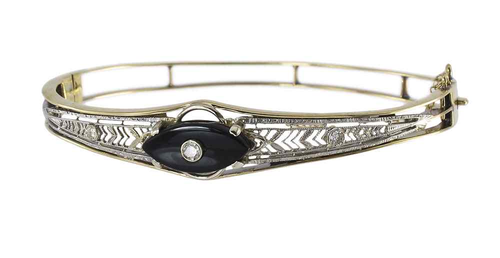 Appraisal: K DIAMOND ONYX BANGLE BRACELET K yellow white gold bangle