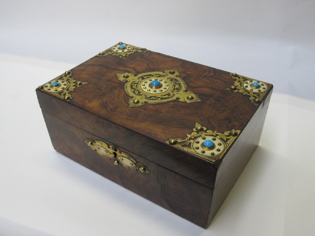 Appraisal: A Victorian walnut sewing trinket box decorated with brass spandrels