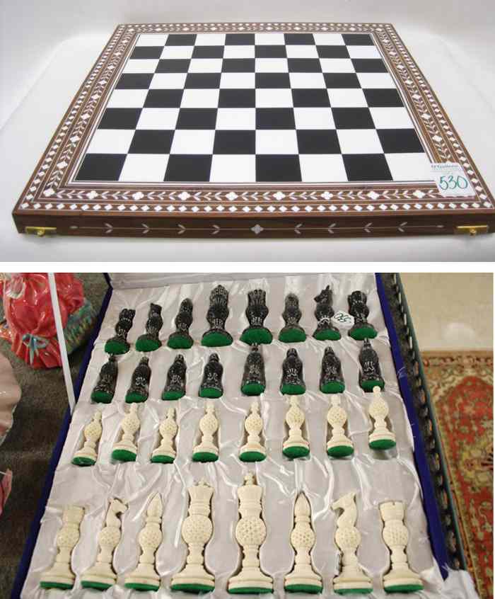 Appraisal: HAND CARVED BONE CHESS SET WITH BOARD natural white and