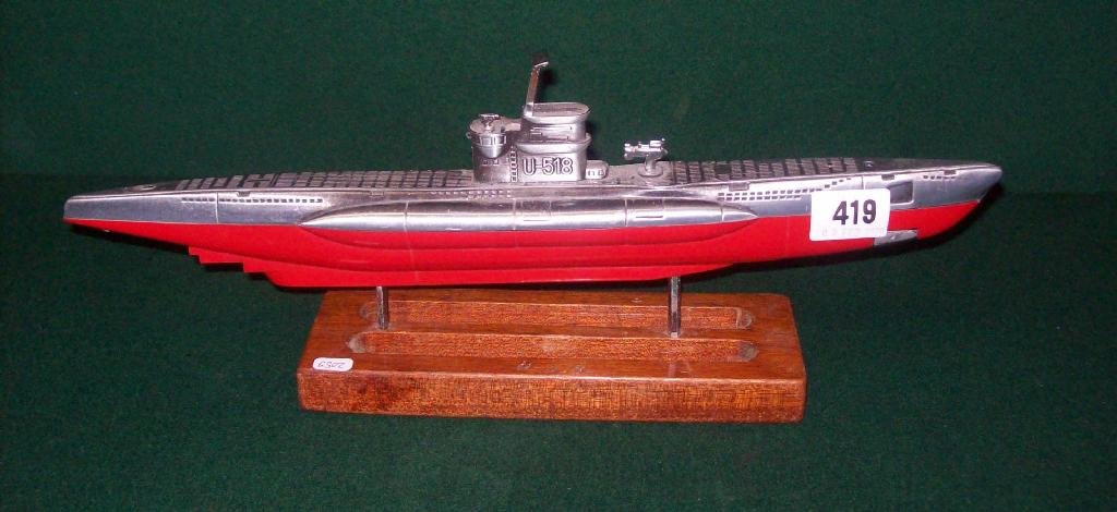 Appraisal: A cigarette lighter in the form of U Boat U