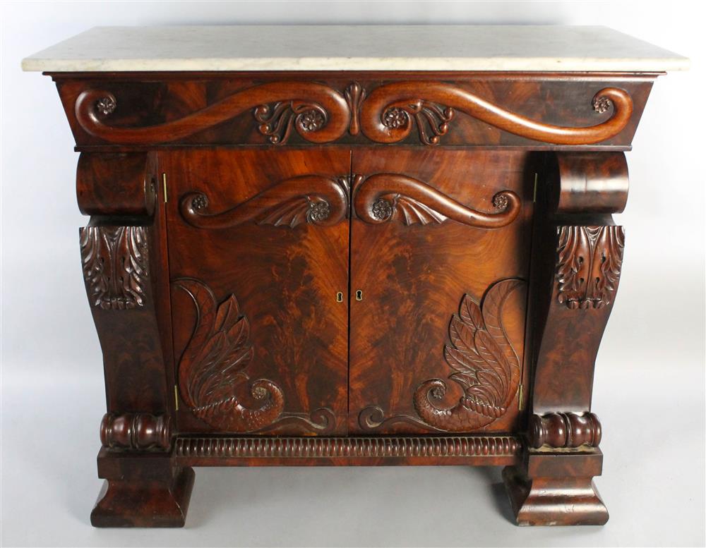 Appraisal: LATE AMERICAN CLASSICAL CARVED MAHOGANY SERVER WITH MARBLE TOP having