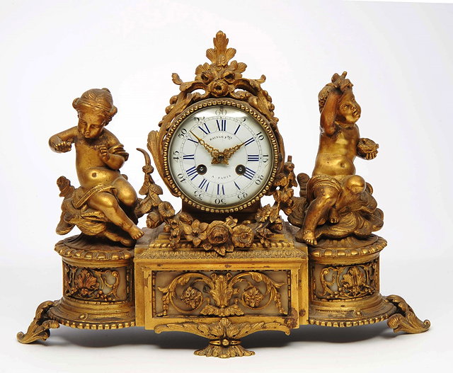 Appraisal: A TH CENTURY FRENCH MANTEL CLOCK the white enamel convex