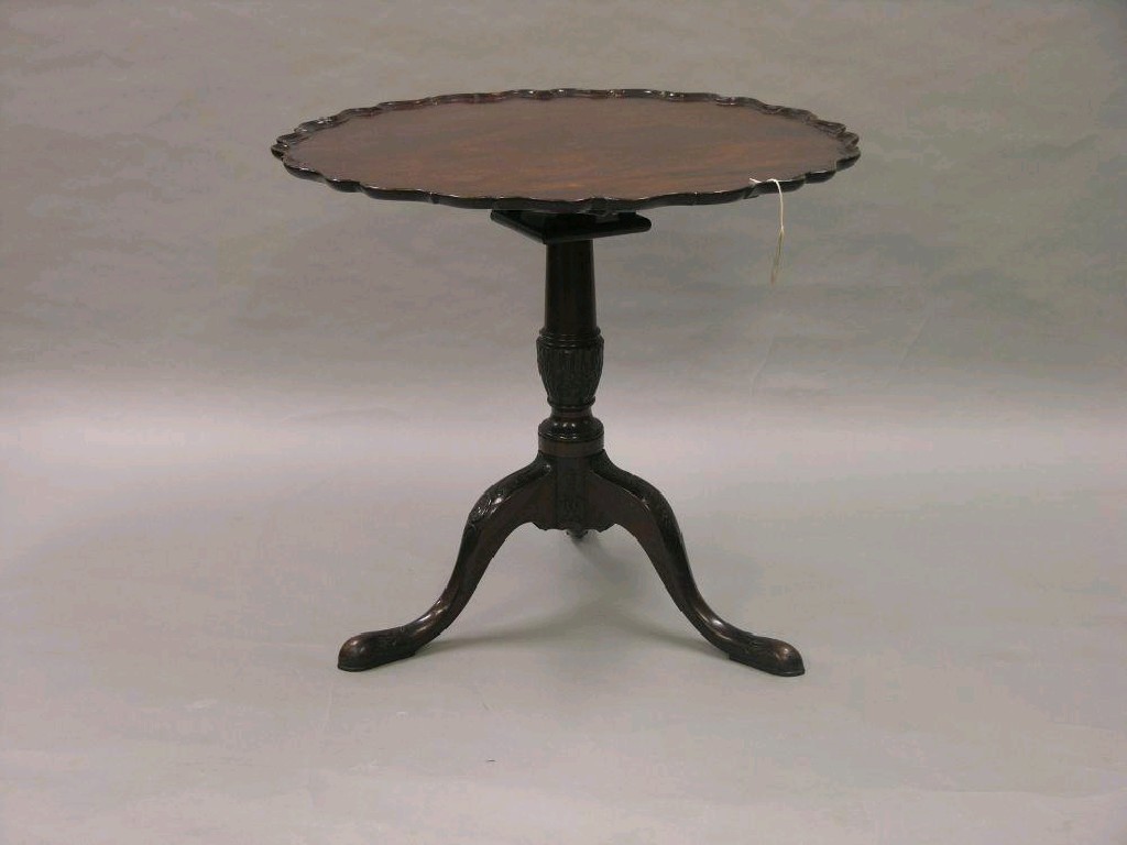 Appraisal: A Victorian Chippendale mahogany tripod table circular top with pie-crust