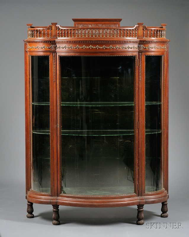 Appraisal: Late Victorian Neoclassical Brass-mounted Carved Cherry Swell-front Vitrine with four