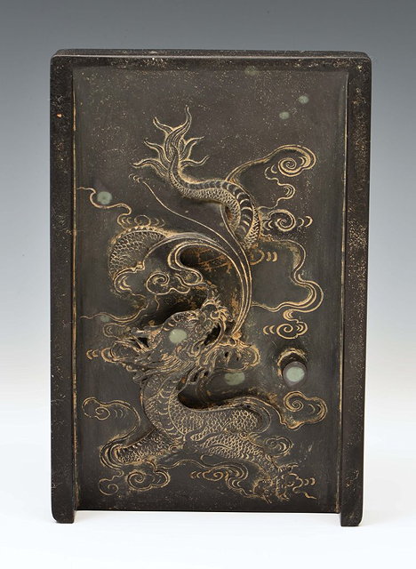 Appraisal: A CHINESE CARVED HARDSTONE INK SLATE with dragon and cloud