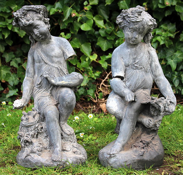 Appraisal: A PAIR OF FAUX DECORATIVE CHERUBS of classical form each