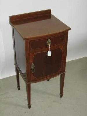 Appraisal: AN EDWARDIAN MAHOGANY BEDSIDE CUPBOARD of bowed form crossbanded with