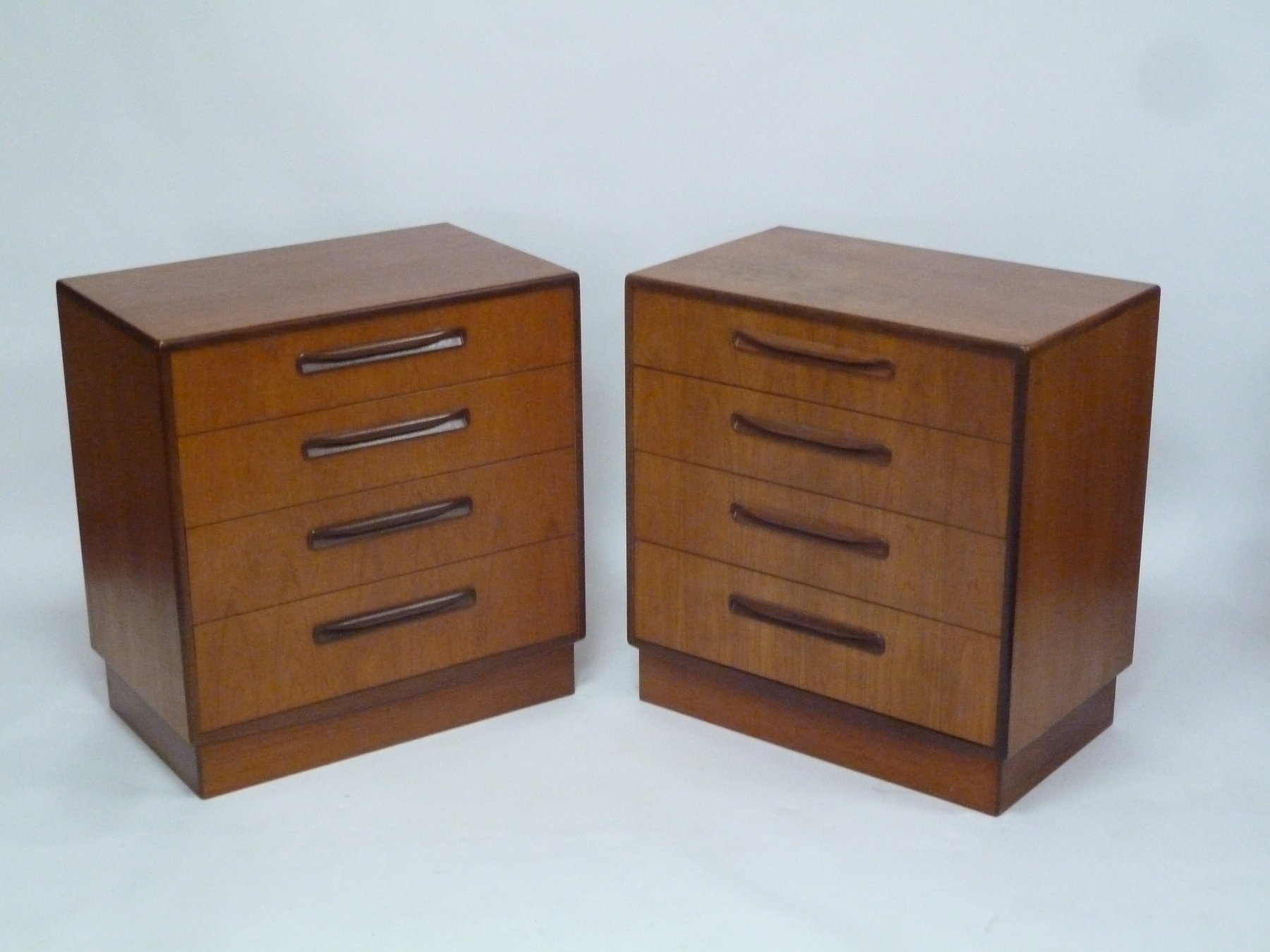 Appraisal: A pair of G-Plan chests each fitted four graduated drawers