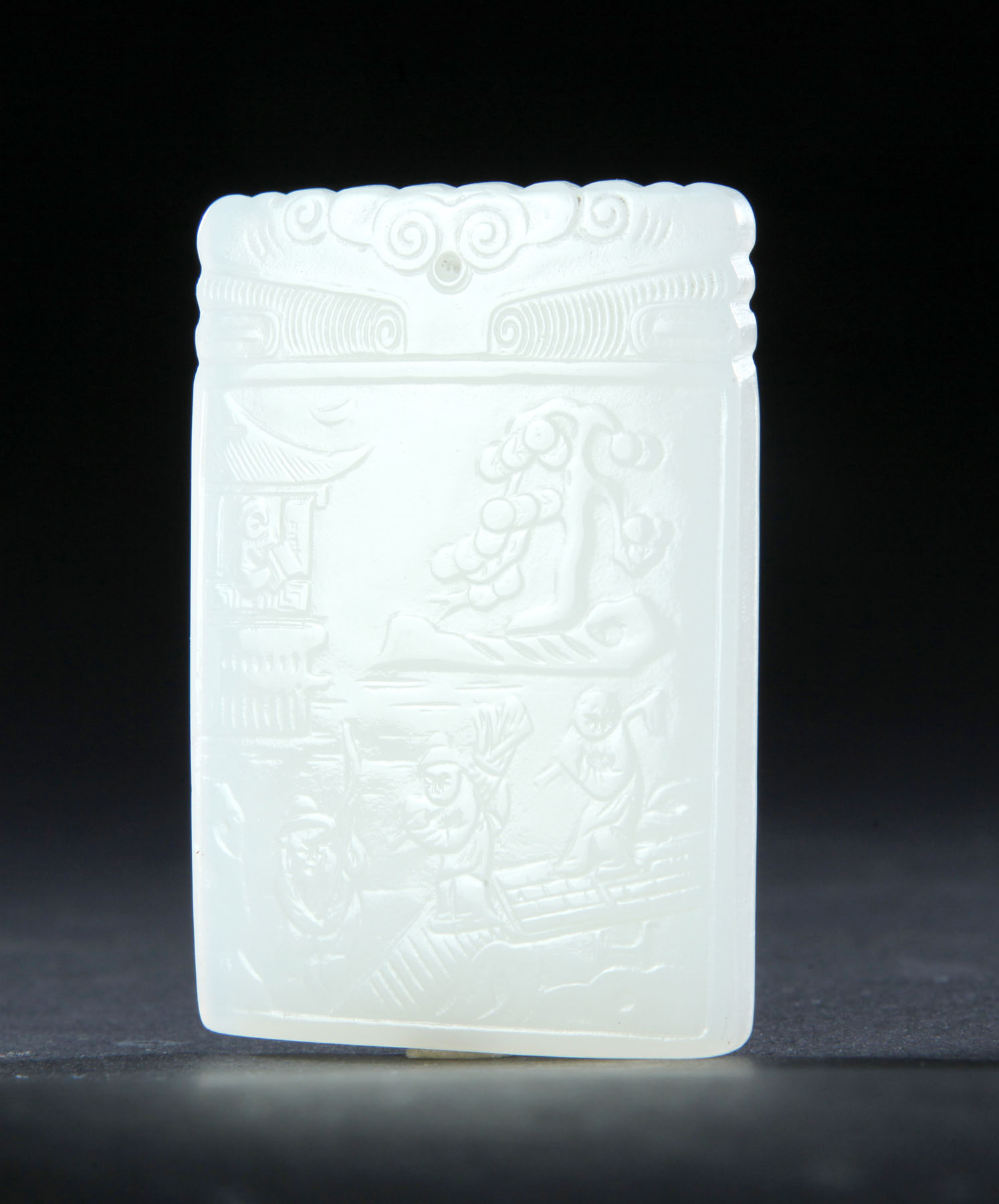 Appraisal: JADE PENDANT China th century Low relief figures on a