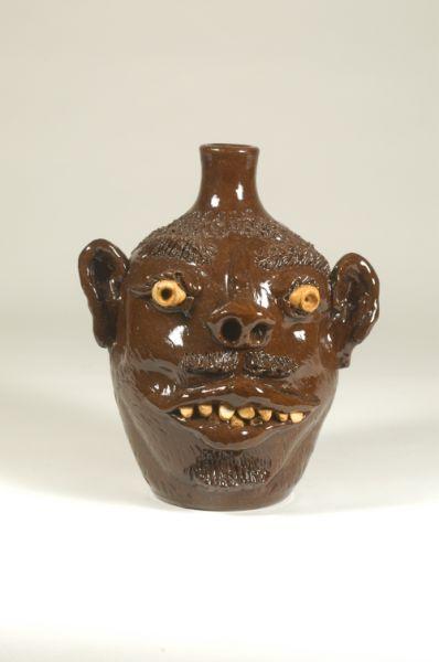 Appraisal: Signed G F Cole - - Slip glazed face jug