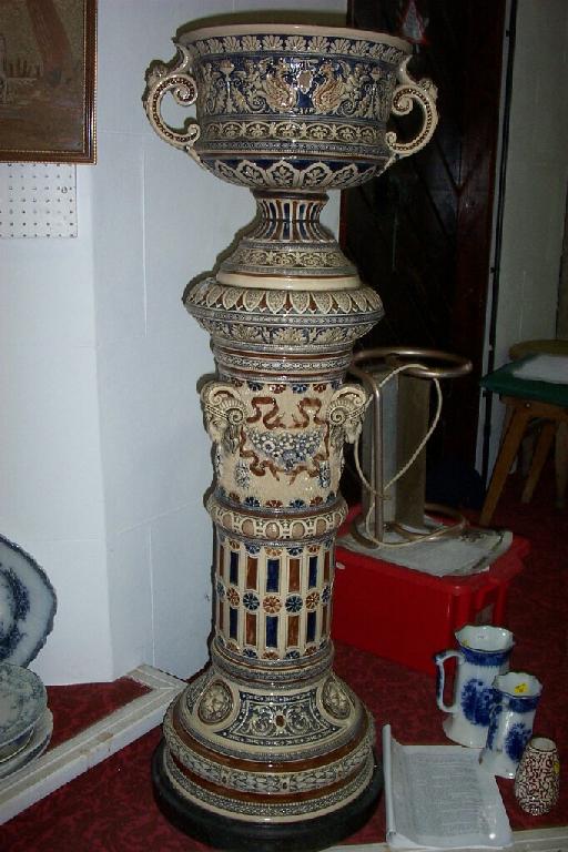 Appraisal: A late th century German stoneware jardiniere and stand the