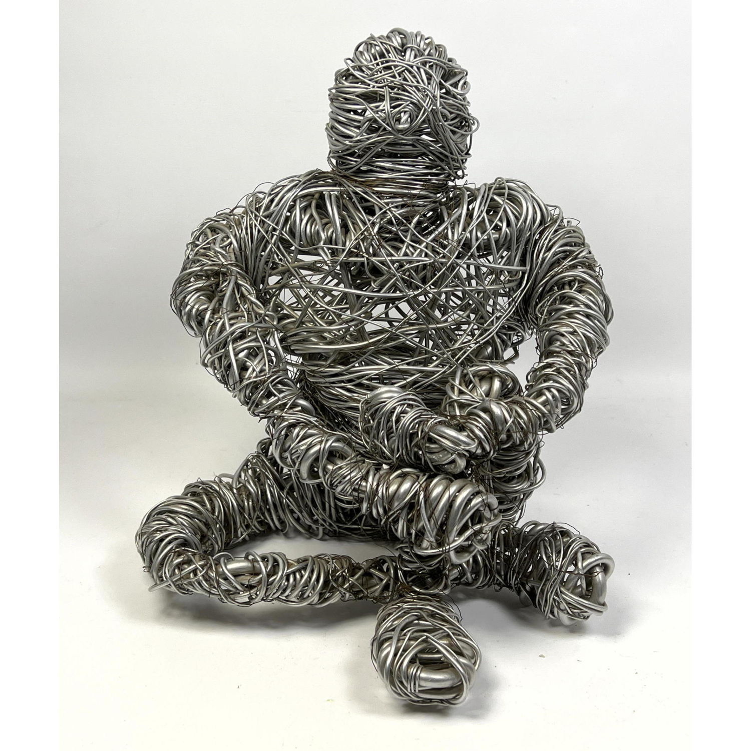 Appraisal: Modernist Wrapped Metal Wire Figural Sculpture Seated human figure Dimensions