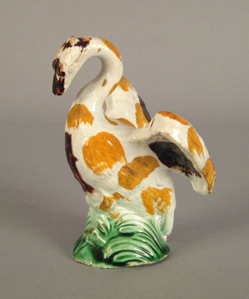 Appraisal: Staffordshire figure of a swan ca with yellow green and