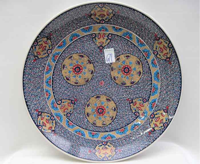 Appraisal: TURKISH IZNIK POTTERY CHARGER hand painted with enamels golden filled