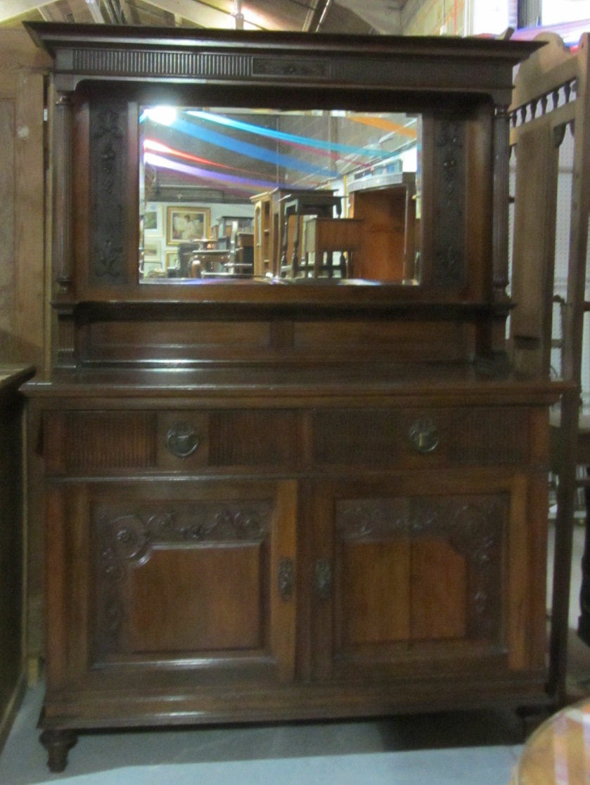 Appraisal: A th century mahogany sideboard with mirror back over a