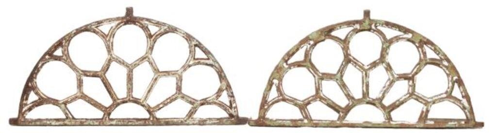 Appraisal: pair Architectural iron lunette-form transoms th c with geometric patterns