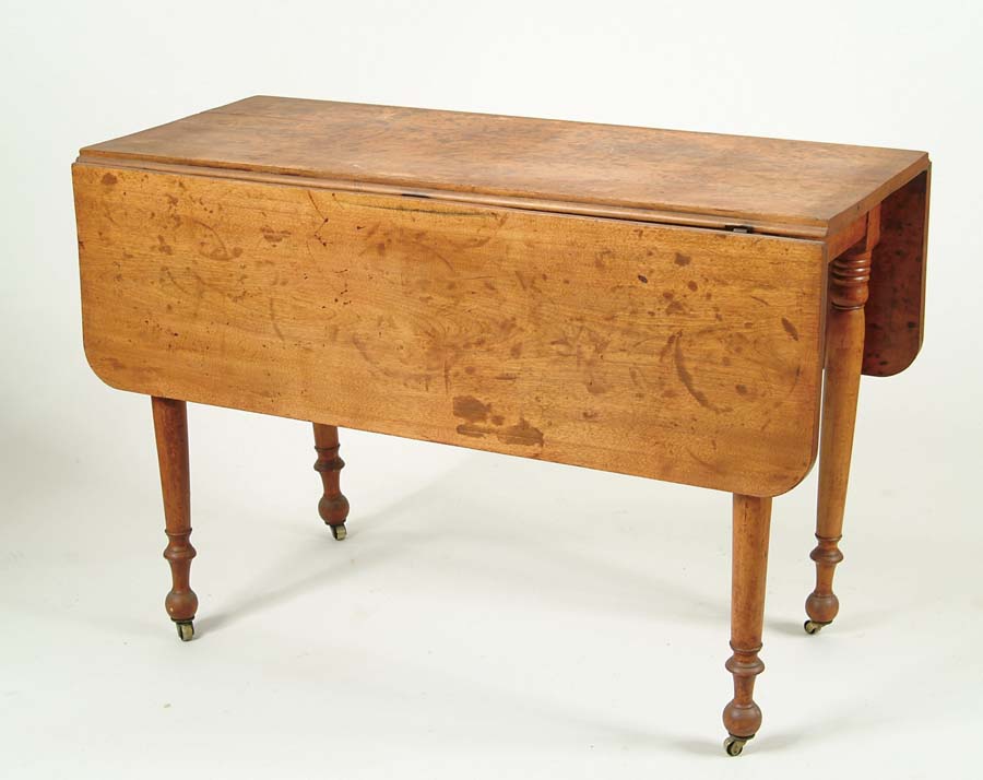 Appraisal: SHERATON BIRCH DROP LEAF TABLE Turned legs end in caster