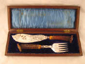 Appraisal: A pair of silver plated fish servers with antler horn