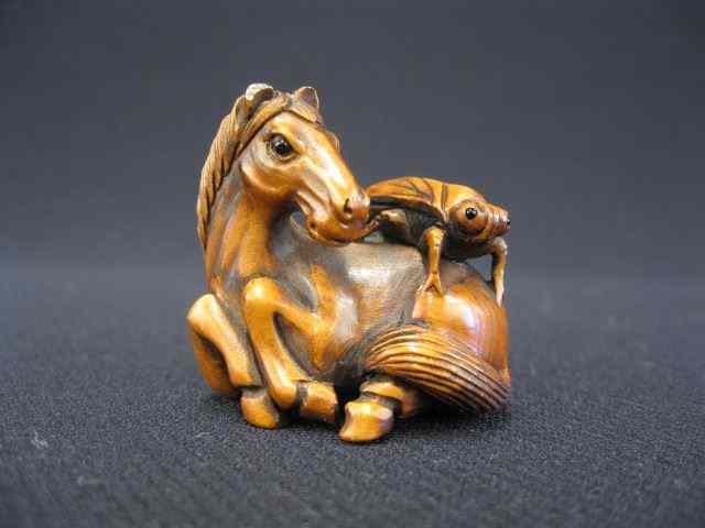 Appraisal: Carved Boxwood Netsuke of a Horse grasshopper on his back