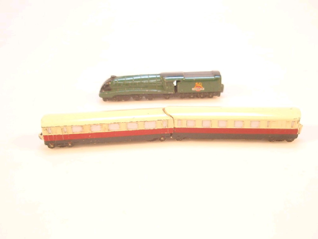 Appraisal: Dinky toys locomotive and two cream carriages