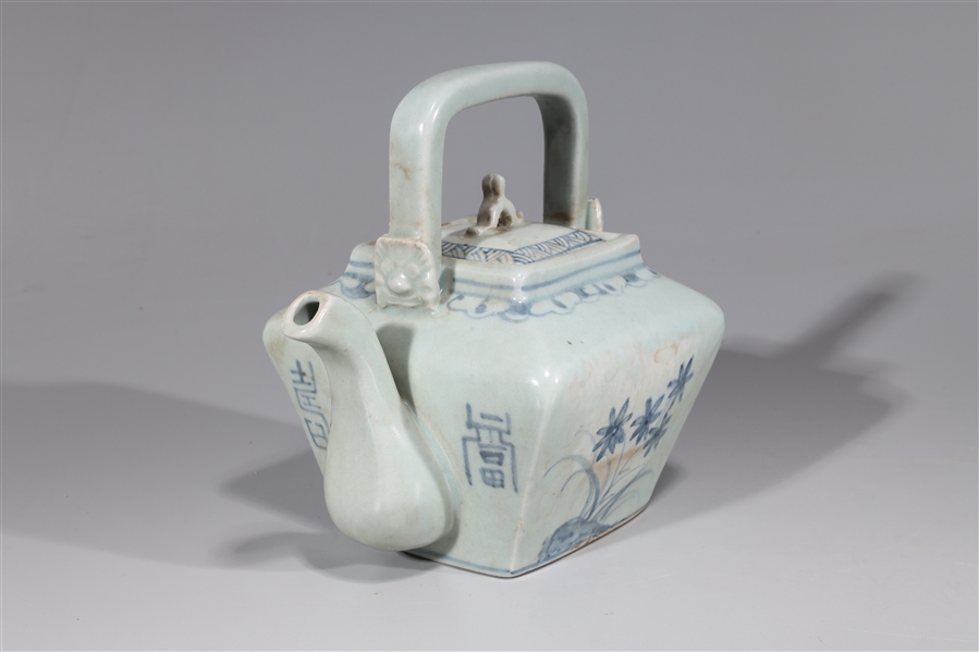 Appraisal: Korean blue and white porcelain covered teapot with floral designs