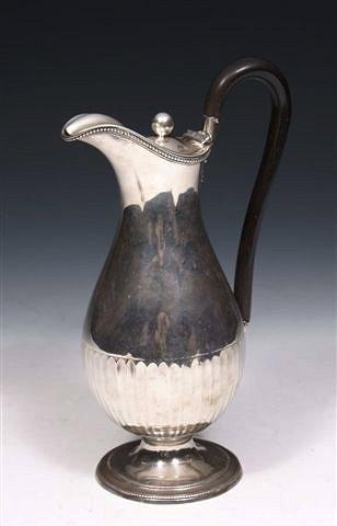 Appraisal: A GEORGE III SILVER EWER with fluted lower body on