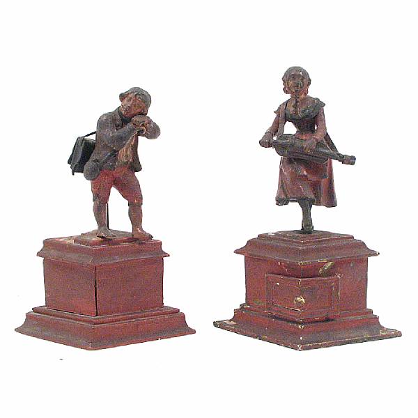 Appraisal: A pair of Victorian painted cast iron and tin figural