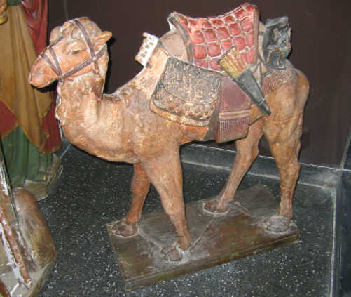 Appraisal: PLASTER FIGURE OF A CAMEL Full figure wearing a packed