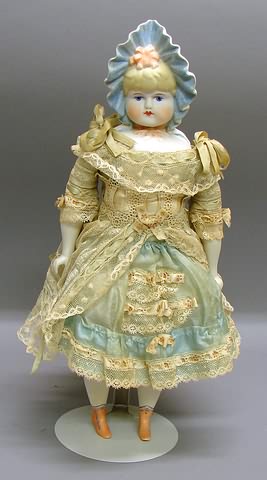 Appraisal: Emma Clear parian doll Painted blue eyes molded peaked bonnet