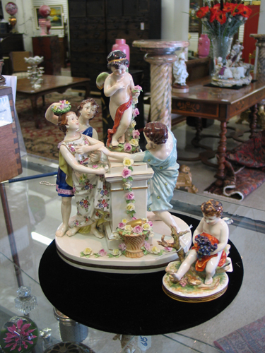 Appraisal: TWO GERMAN PORCELAIN FIGURES one a group with woman and