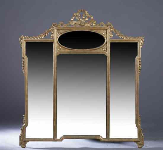 Appraisal: LOUIS XVI STYLE GILT-COMPOSITION OVERMANTEL MIRROR Carved ribbon crest oval