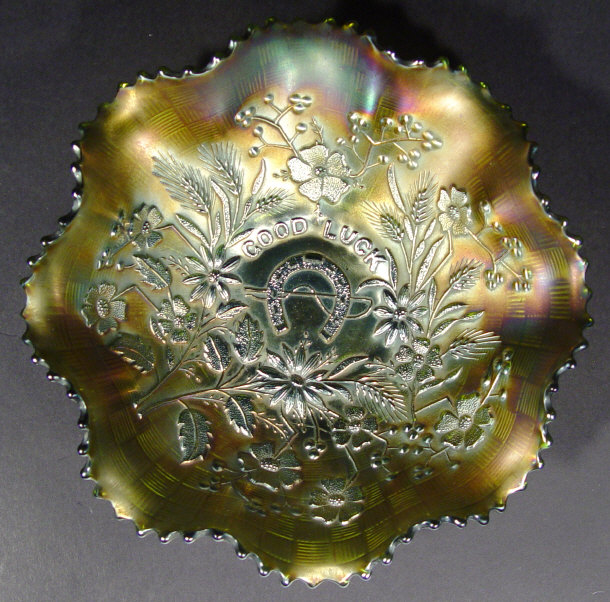 Appraisal: Green carnival glass bowl moulded with a horseshoe and script